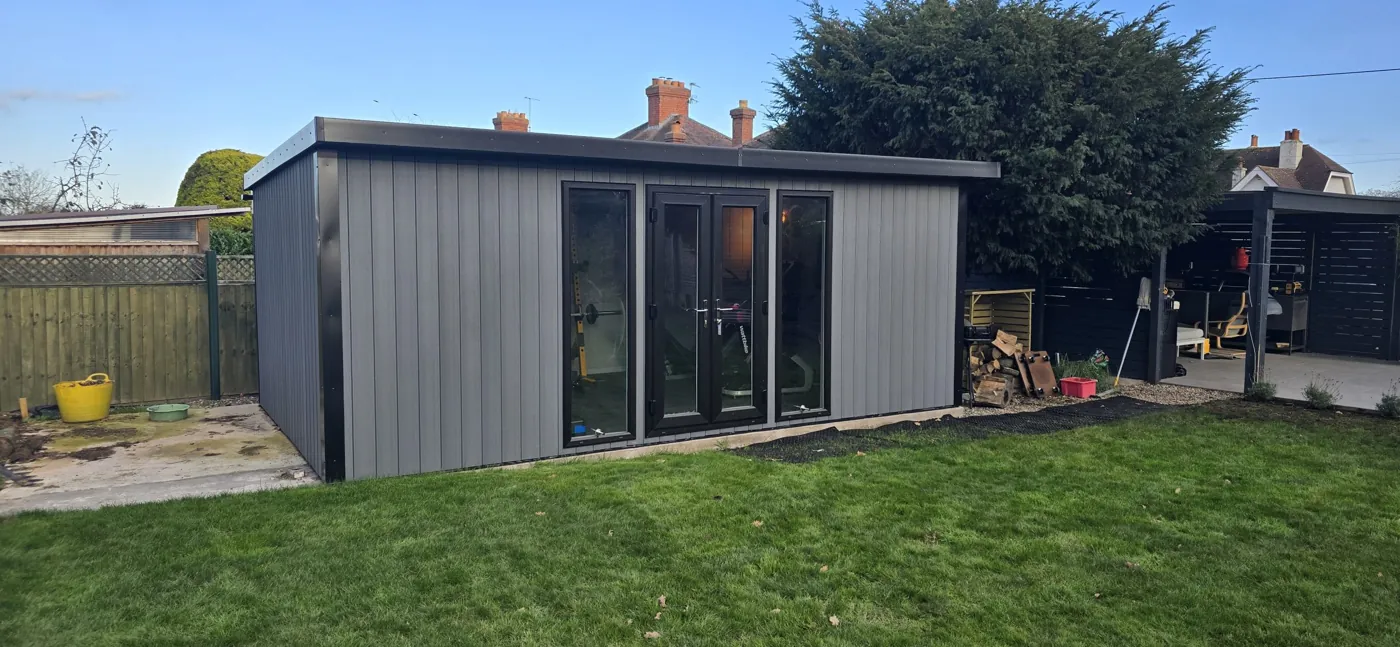 Grey Noah garden building at the end of a Shropshire lawn