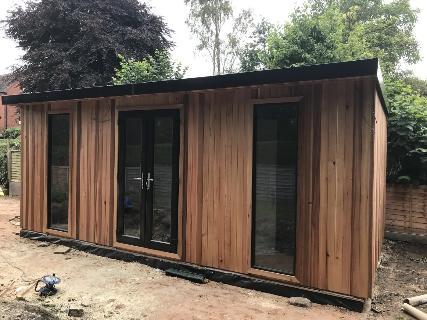 Cedar-clad Woburn eco pod newly installed in a garden