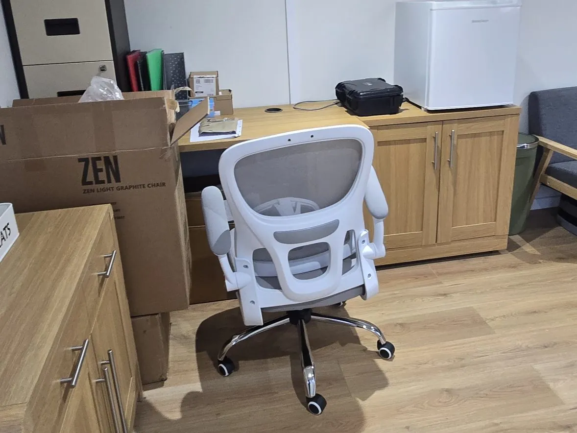 Inside the woodland office, with a desk, office chair and storage on a wood-effect floor