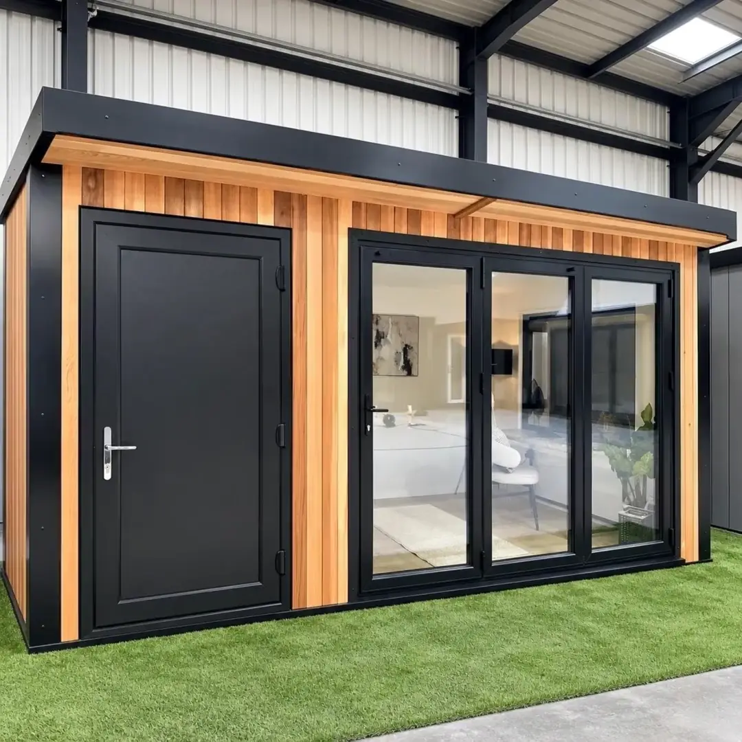 Cedar and black clad display garden room with bi-fold doors in the Noah showroom