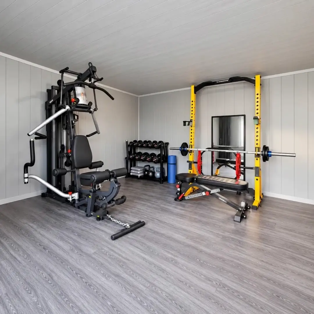 Home gym equipment inside the garden building at the Shropshire project