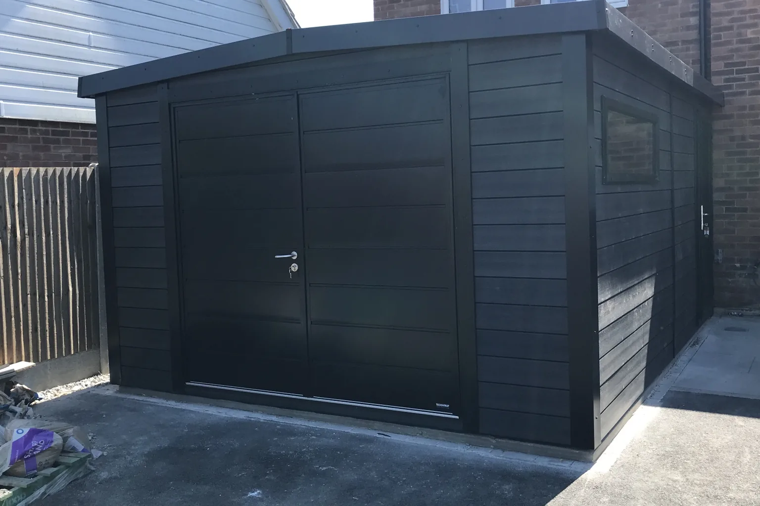 Black composite Noah garage with insulated metal double doors