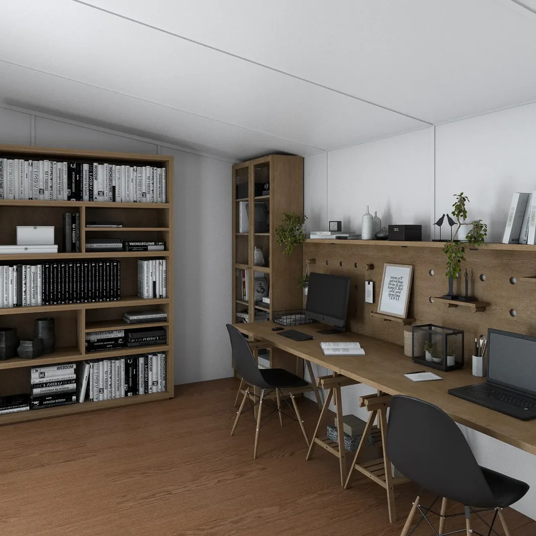 Large office set up inside a Noah building, with two long desks, shelving and bookcases